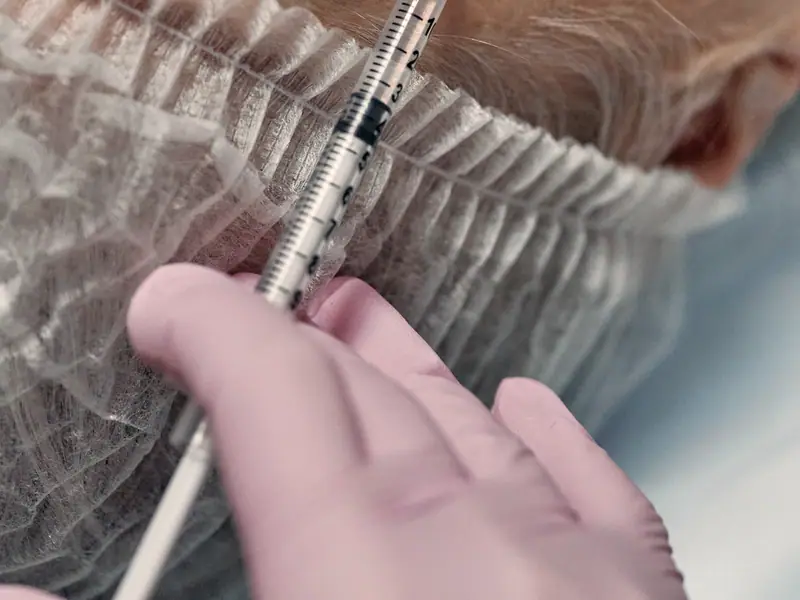 An injectable aesthetic treatment being carried out in a clinic